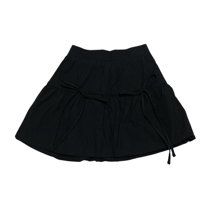 A black bubble skirt with double ribbons tied at the waist.